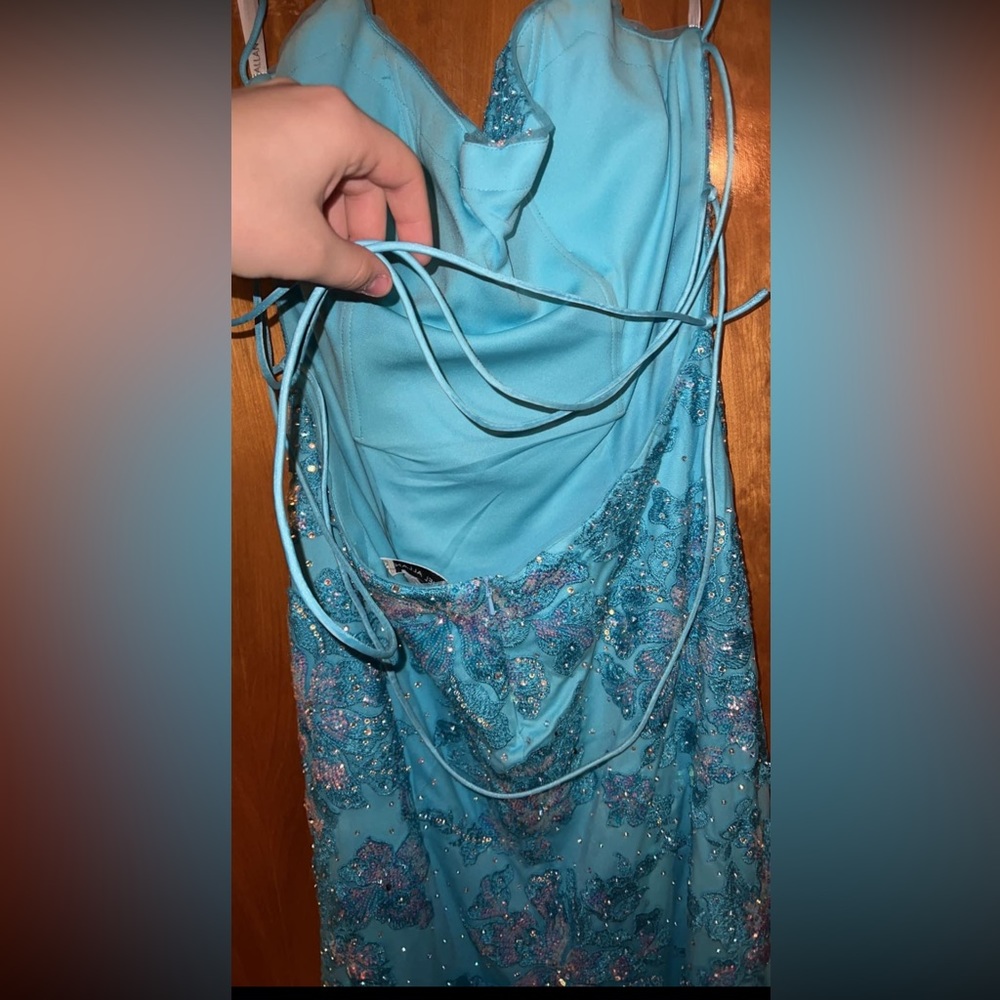 Rachel Allan size12 runs small. Sea blue with pink,blue sequins. Tulle overlay.